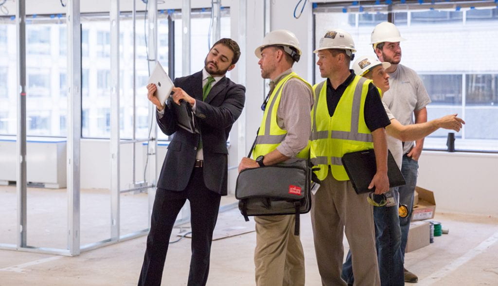 Joe Velez speaking with construction crew at VSTC